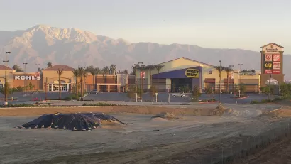 empty parking lot of Eastvale, California's best buy and kohl's, mountains in background