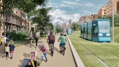 A rendering of the Beltline Streetcar running on a grassy field (with rail tracks) next to a walking and biking path.