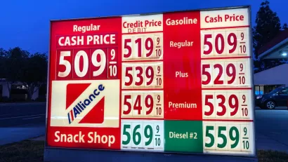 A sign showing gas prices, all at more than $5 a gallon.