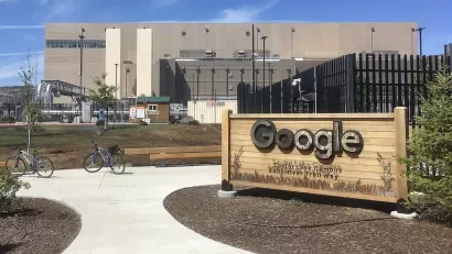 Data center with Google sign in front of black fence in The Dalles, Oregon.