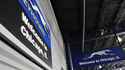 Close-up of Welcome to Chicago sign with Greyhound bus company logo in downtown Chicago, Illinois bus terminal.