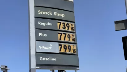A sign with gas prices all listed above $7.39 per gallon.