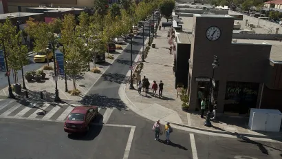 Lancaster Boulevard with tree-lined median and wide sidewalks in Lancaster, California.