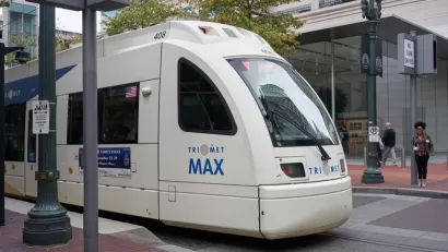 A TriMet MAX Red Line light rail train heading for the Portland International Airport comes to a stop at Pioneer Place in downtown Portland.