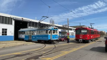 A pair of vintage Siemens–Duewag U2 trolleys roll out of a garage in Memphis.