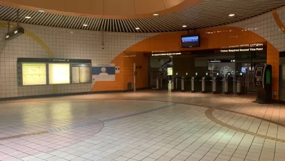 Empty corridor at North Hollywood Metro station with orange and white tiles in North Hollywood, California.