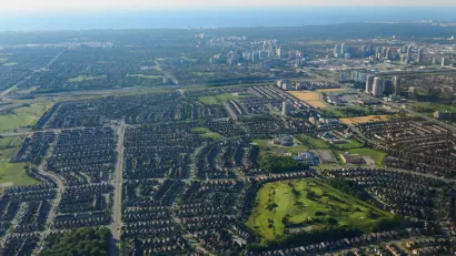 An aerial view of Mississauga, Ontario, with Lake Ontario in the background.