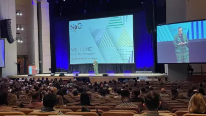 View of the stage, crowd, and speaker at the opening session of NPC24.