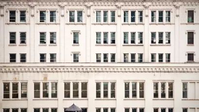 A closeup of rows of buildings lined by old fashioned windows in New York City.