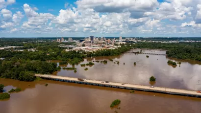 The Pearl River floods with brown near downtown Jackson, Mississippi.