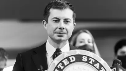 A black and white photo of U.S. Transportation Secretary Pete Buttigieg.