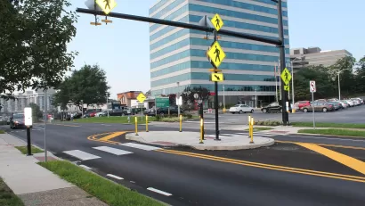 Two-lane street with pedestrian crossing island
