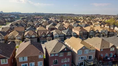Row after row after row of single-family residences, with the high rises of the city of Toronto looming far in the background.