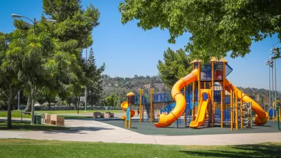 Playground with yellow slides in Rimgrove Park, Los Angeles County