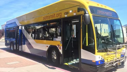 Blue and yellow 40-foot public transit bus in San Luis Obispo.