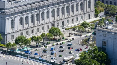 A group of socially distanced tents for the homeless are set up on a parking lot in San Francisco's Civic Center.