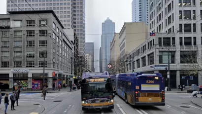 Google Street View of Third Avenue in Seattle with buses and pedestrians