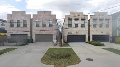 Two-story split lot housing in Houston, Texas with two-car garages