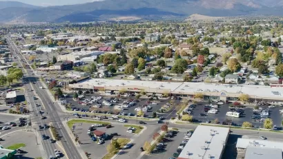 Aerial view of midtown Missoula, Montana with mountains in background