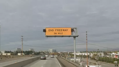 Google street view of yellow "End Freeway 1/4 mile" sign on 90 freeway in Los Angeles, California.