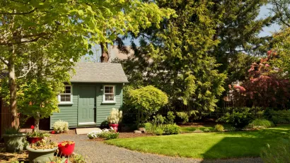 Small green ADU cottage in lush backyard in San Jose, California.