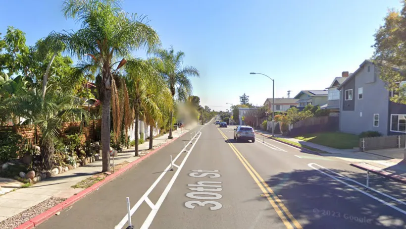 Google street view of protected bike lane on street in San Diego, California.