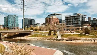 South Platte River surrounded by apartments and office buildings at Shoemaker Plaza in Confluence Park. Denver, Colorado
