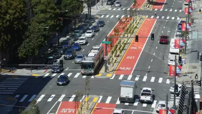 Aerial view of red center bus rapid transit lane with bus on Van Ness Avenue in San Francisco, California