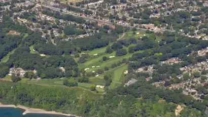 An aerial view of the Toronto Hunt Club and golf course, located along Lake Ontario amid residential homes in Toronto.