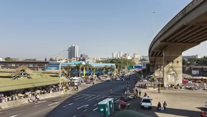 The public market at Warwick JUnction in Durban, South Africa is visible with the city ‘s high-rise buildings in the background.