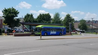 Pulse bus rapid transit station with blue bus pulled in in Richmond, Virginia