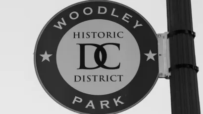 A sign on the side of a street light reads “Woodley Park Historic District D.C.”
