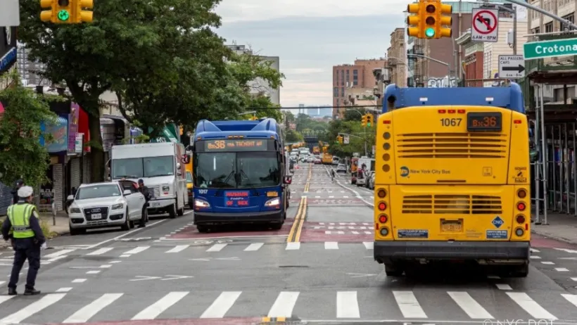 The new busway. The pavement is painted red, indicating it as a bus-only lane.