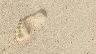 Footprint on sand at beach