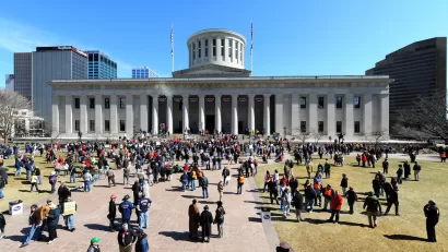 A photo of protesters on the front lawn of the Ohio Statehouse during the State of the Union speech by Governer Kasich.