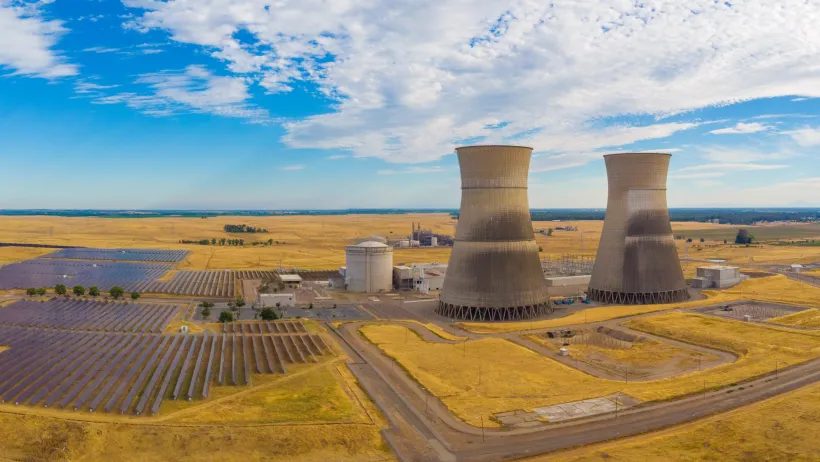 Rancho Seco Nuclear Power Plant cooling towers above solar panels plant.
