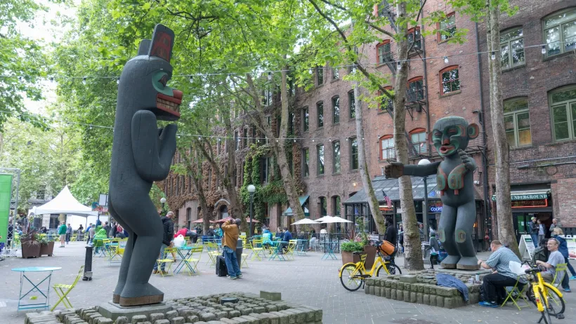 Two large totem-style sculptures in Pioneer Square plana in Seattle, Washington.