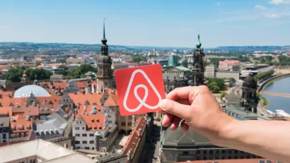 Airbnb logo over Dresden