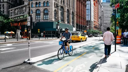 A rider on a Citibike on a bike lane in New York City