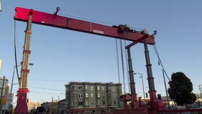 Construction crane and equipment on 4th Street for Central Subway project in San Francisco, California