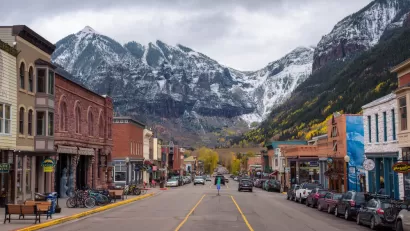 View from middle of street in downtown Telluride, Colorado with mountains in background