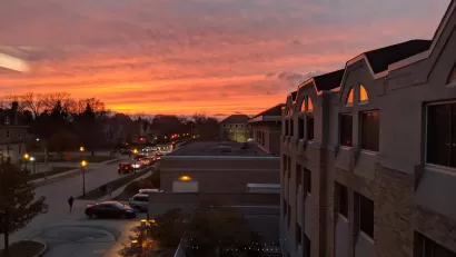 Suburban houses against colorful sunset sky in Waukesha, Wisconsin