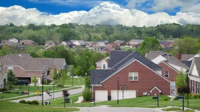 A Community of Brick Suburban Homes on a cloudy summer day