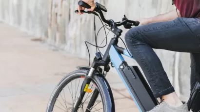 Close-up of person sitting on electric bike