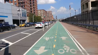 Green painted bike lane with delineators in Hoboken, New Jersey
