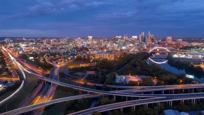Pink light before morning dawn sun reflects on clouds over downtown Nashville TN