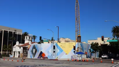 Construction fence and crane