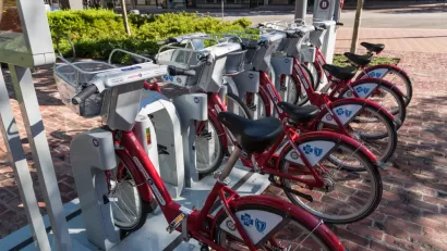 Docked BCycle bike share station in Houston with red bikes