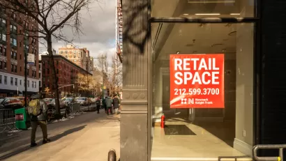 Vacant storefront on a New York City street with For Lease sign