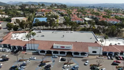 Aerial view of large store with parking and houses with beach in background in Rancho Penasquitos, California